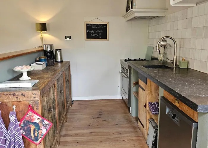 Logeerderij Tussen Koe & Kroonluchter Séjour à la ferme